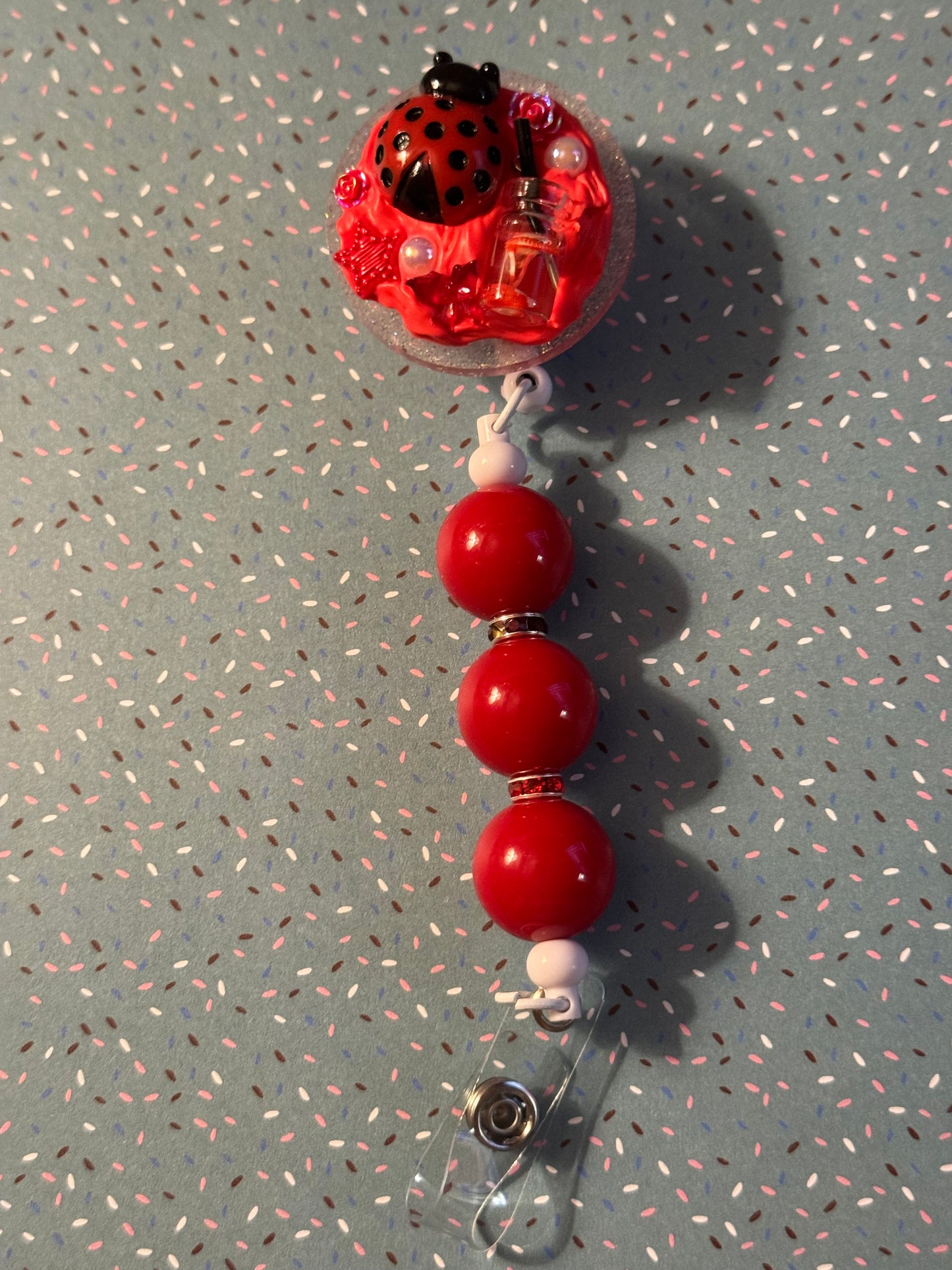 Ladybug badge Reel